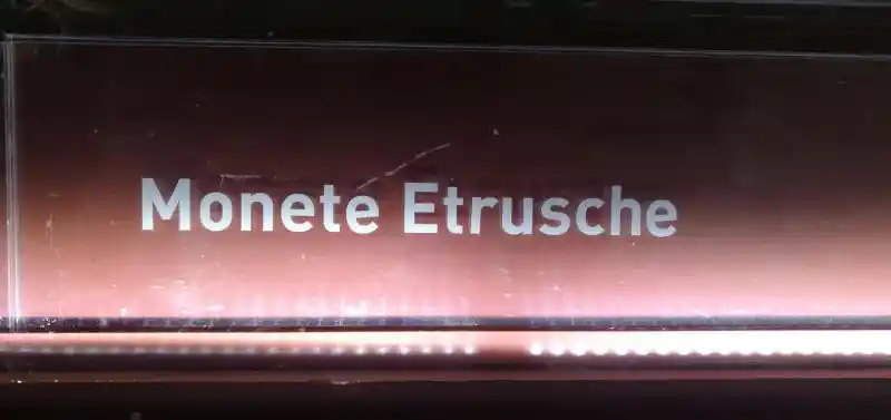 Four-point crosses on Etruscan coins, Santa Maria della Scala
